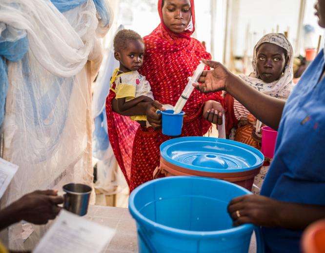 Distribution of therapeutic feeding milk in the nutrition tent at Adré pediatric hospital, where refugees from Sudan receive care. 