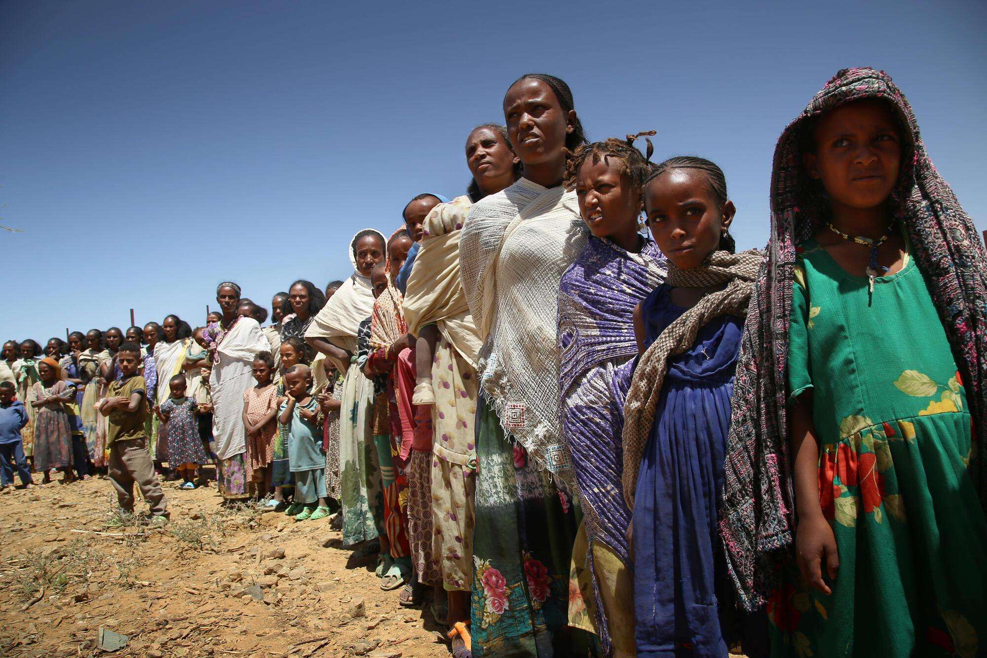 Women and their children waiting for a consultation at the MSF mobile clinic, in the village of Adiftaw. Ethiopia, March 2021.