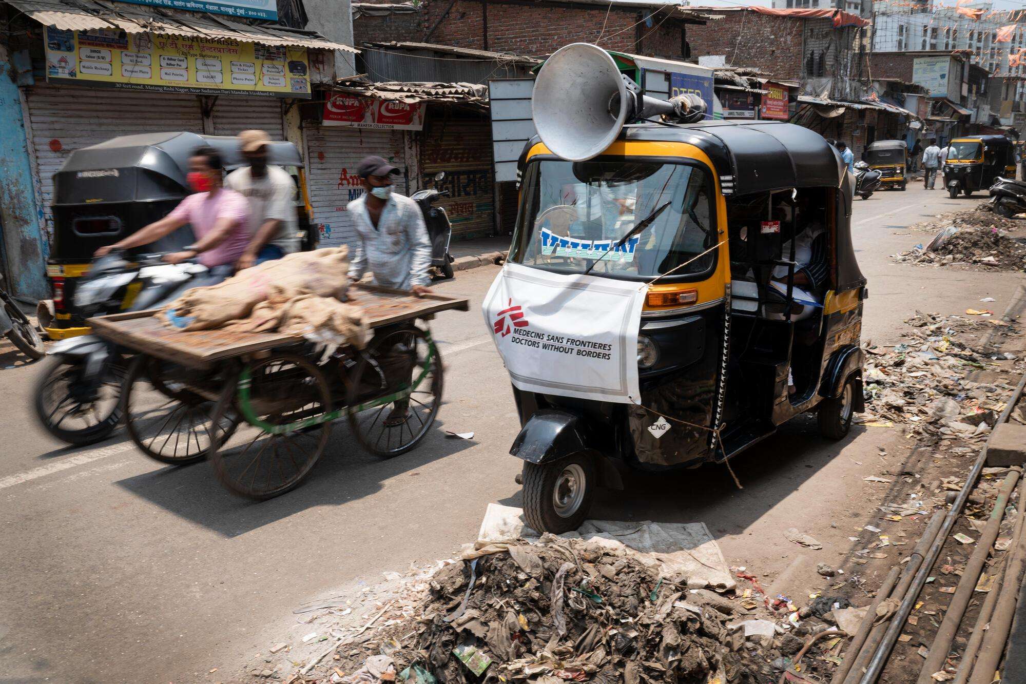 MSF team in using Auto-Rikshaw (tuktuk) to raise COVID-19 awareness among the most vulnerable population, in Mumbai. India, May 2021.