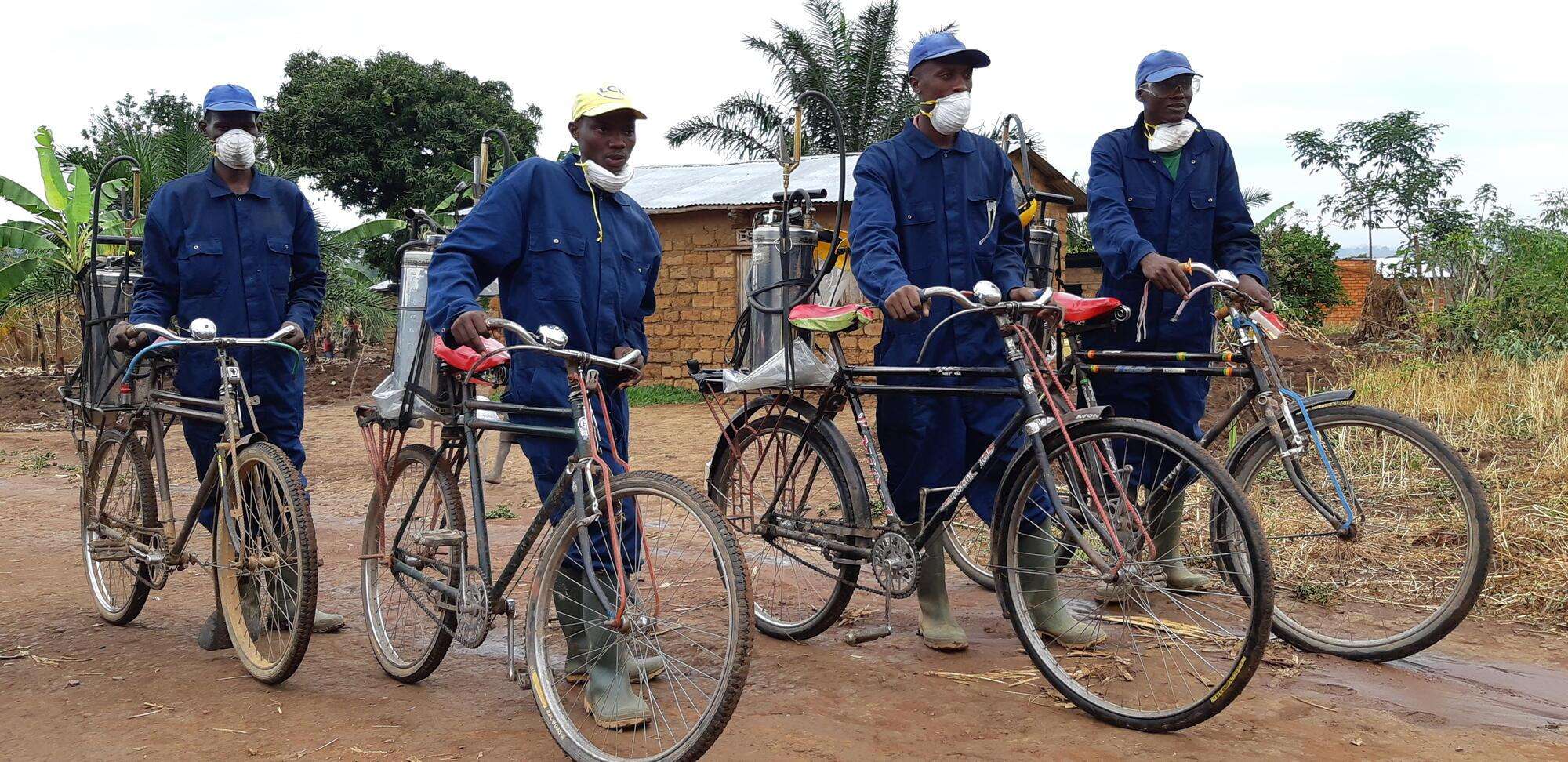 An MSF spraying team arrives in a village to treat houses against mosquitoes