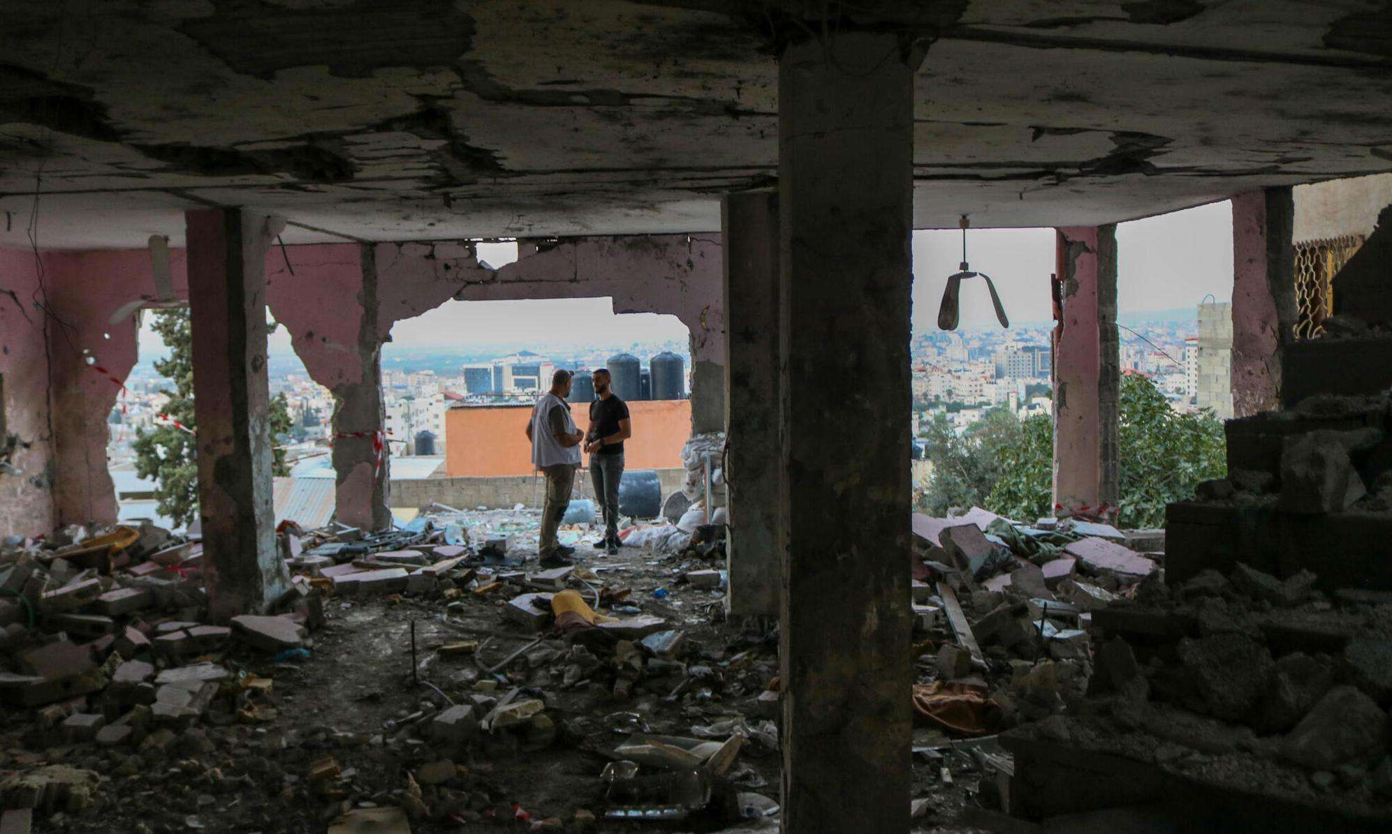 MSF staff and local paramedics inspect the remnants of a mosque that was destroyed in an airstrike in Jenin refugee camp in the West Bank, Palestine.