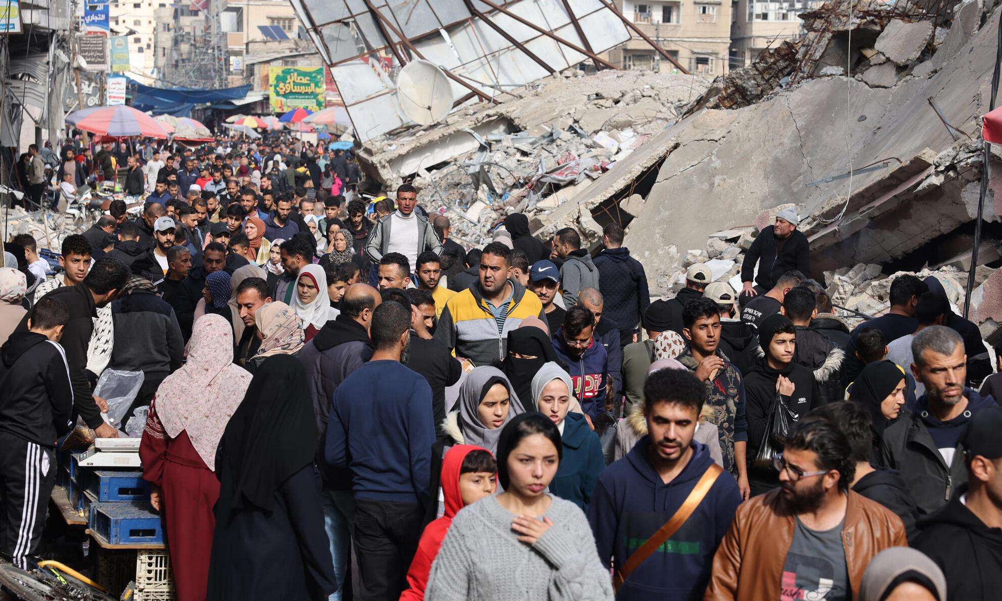 Palestinians crowded into the streets of Rafah in southern Gaza.