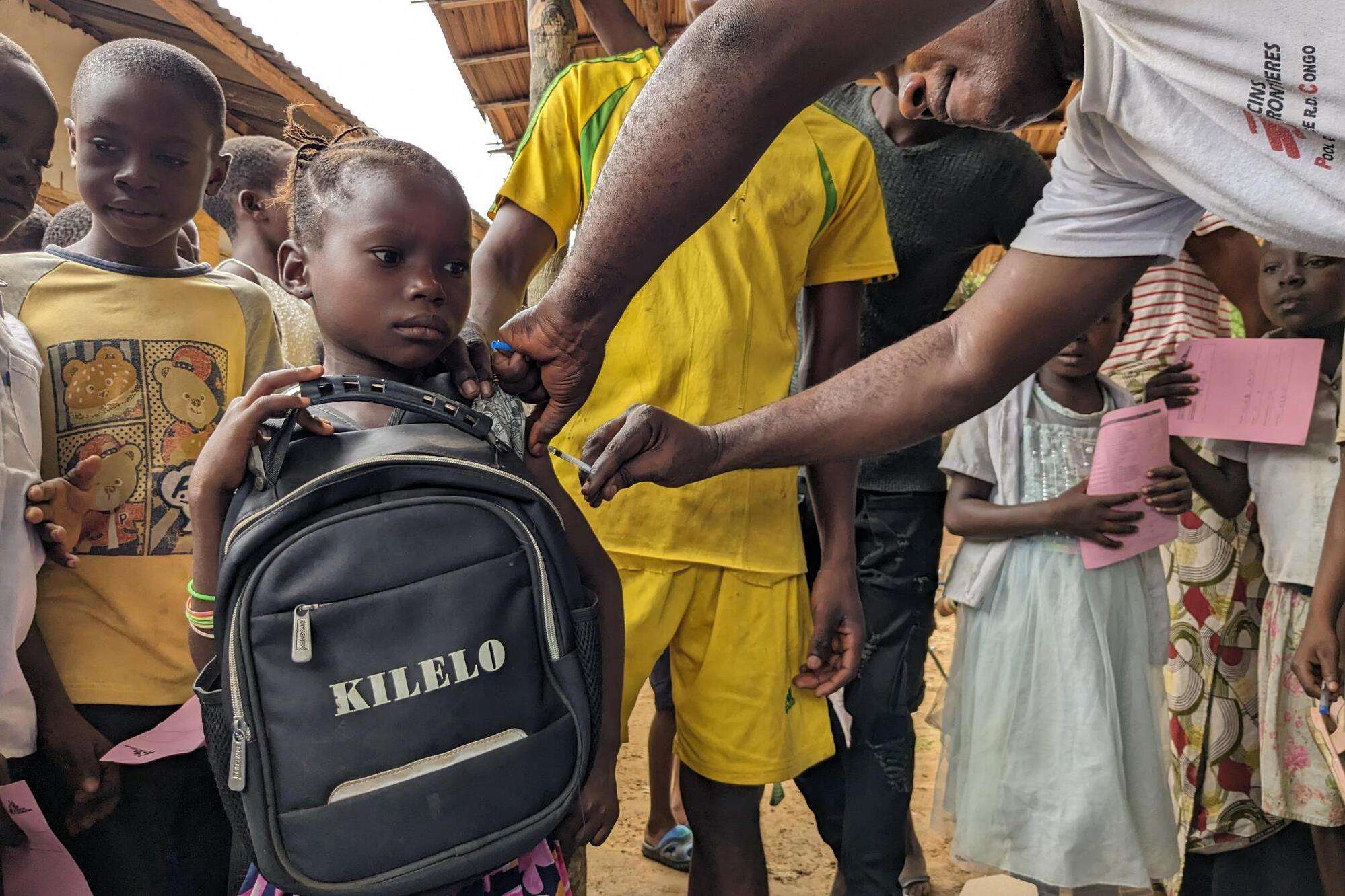 A child is vaccinated for measles in Ingende health zone, DRC.