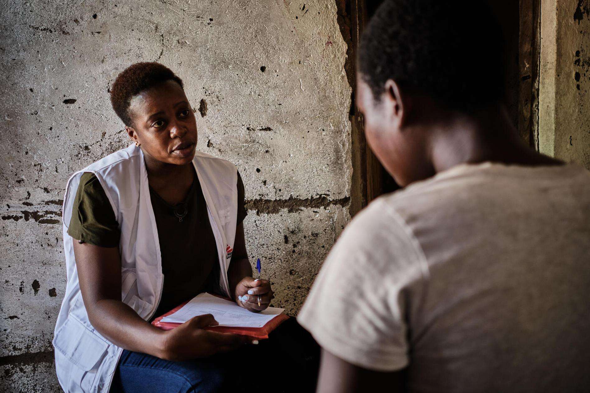 Miriam Mbwana, a mental health counselor with MSF, talks to a sex worker seeking psychological support in Malawi