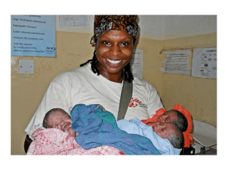 Dr. Africa Stewart holding newborn babies