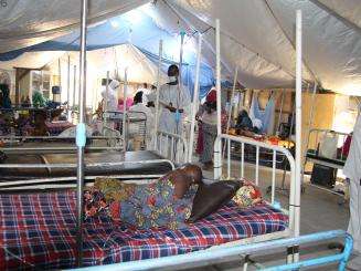 Patient laying in bed in a Zabarmari clinic