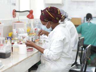 A technician works on a culture in the the CSref bacteriology laboratory in Koutiala, Mali.