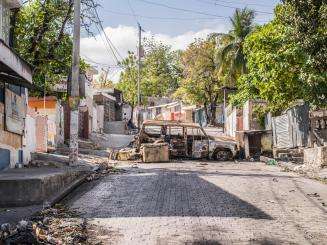 A destroyed car blocking a road in Port-au-Prince, Haiti.