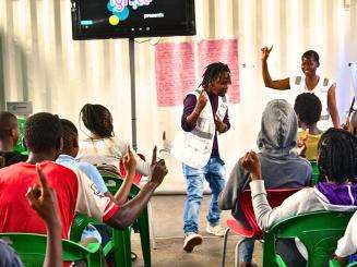 MSF staff lead youth in an ice breaker session at the Dandora Youth Friendly Center in Nairobi, Kenya.