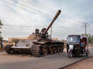 A tank beside a rickshaw in El Geneina, West Darfur, Sudan.