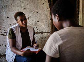 Miriam Mbwana, a mental health counselor with MSF, talks to a sex worker seeking psychological support in Malawi