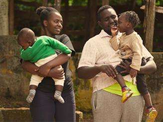 Michael Karongo with his wife Mary Wairimu—his greatest supporter in his recovery journey—and their children in Kenya.