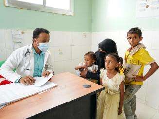 An MSF nurse reviews a pediatric patient's file in Yemen. 