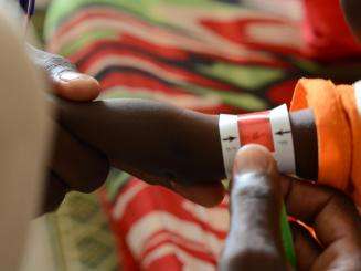 A child is screened for malnutrition in Zamzam camp, Sudan.