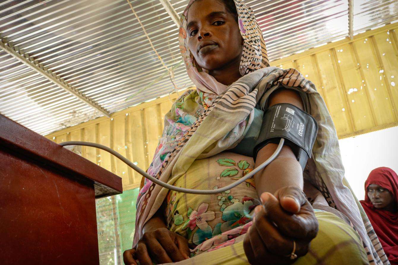 A woman has her blood pressure measured at a hospital in South Darfur, Sudan.