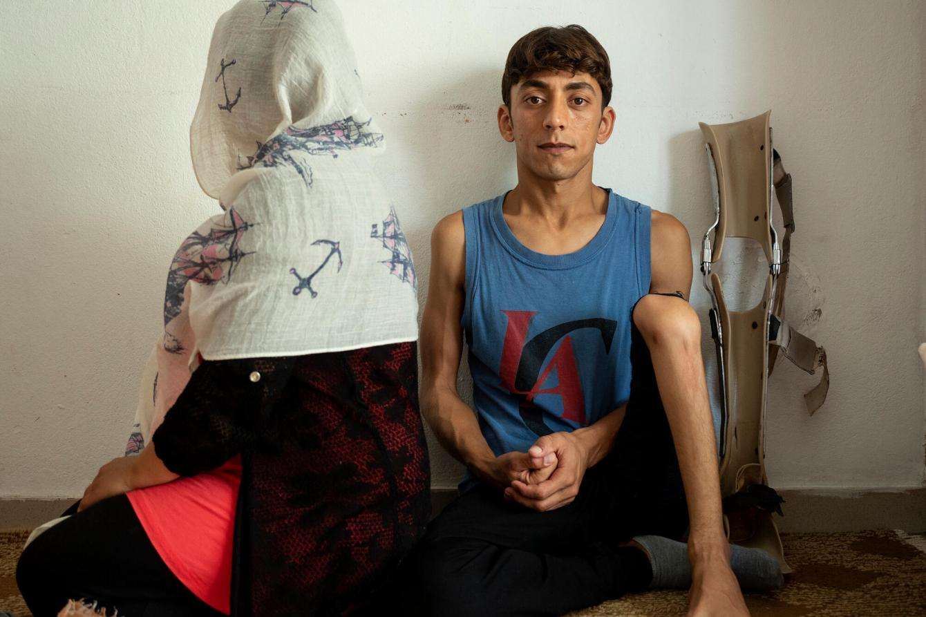 Son and mother sit next to each other 