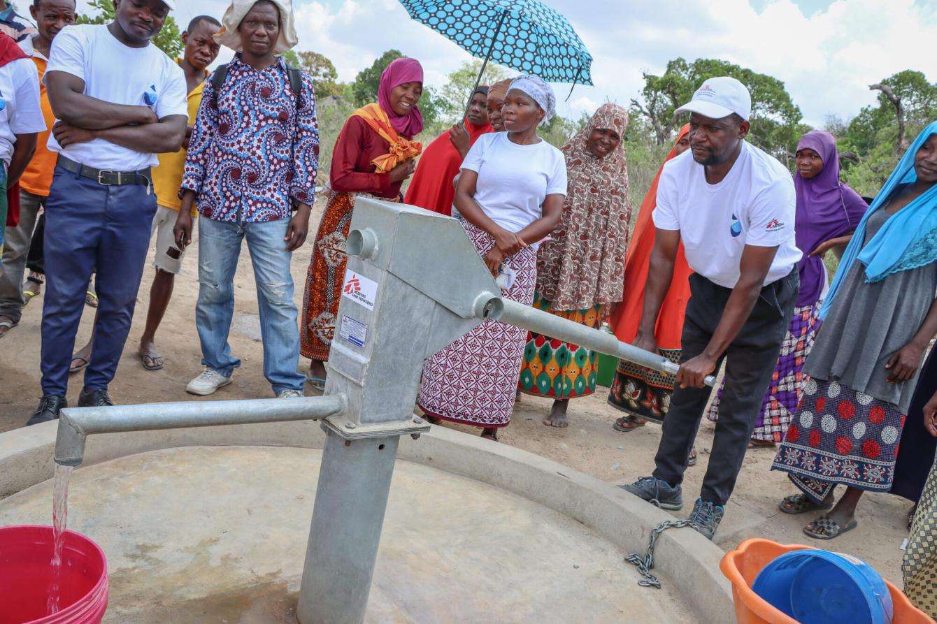 The president of the water committee explains how the water pump works.