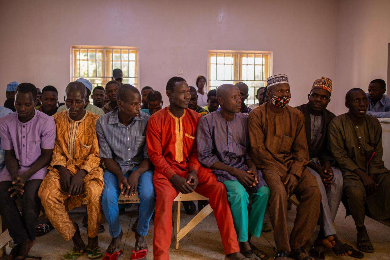 A group of men wait at the blood collection point located at Jahun general hospital.