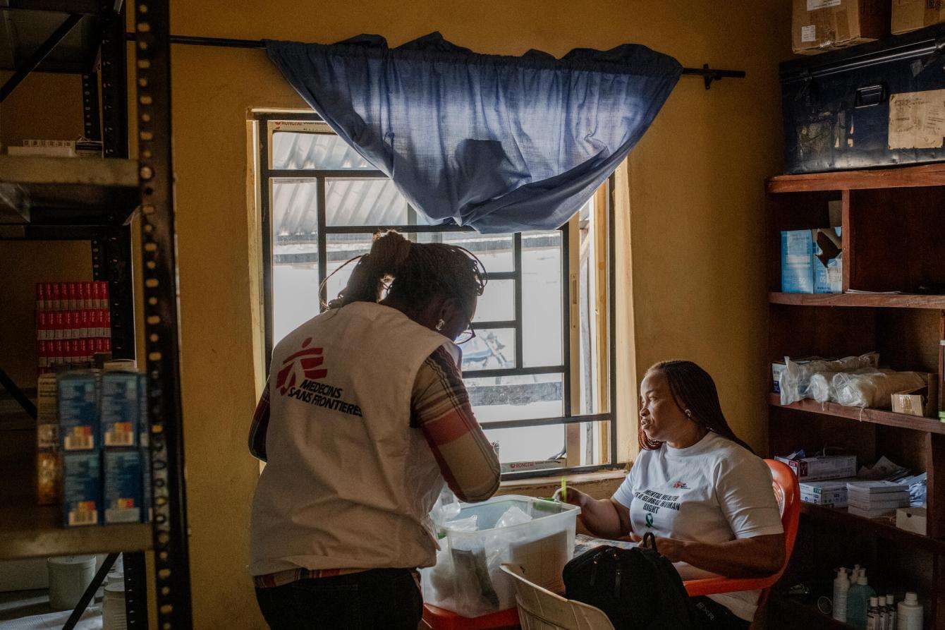 MSF staff prepare a medicine box to treat sexual violence patients at MSF's pharmacy in Mbawa camp, Nigeria.