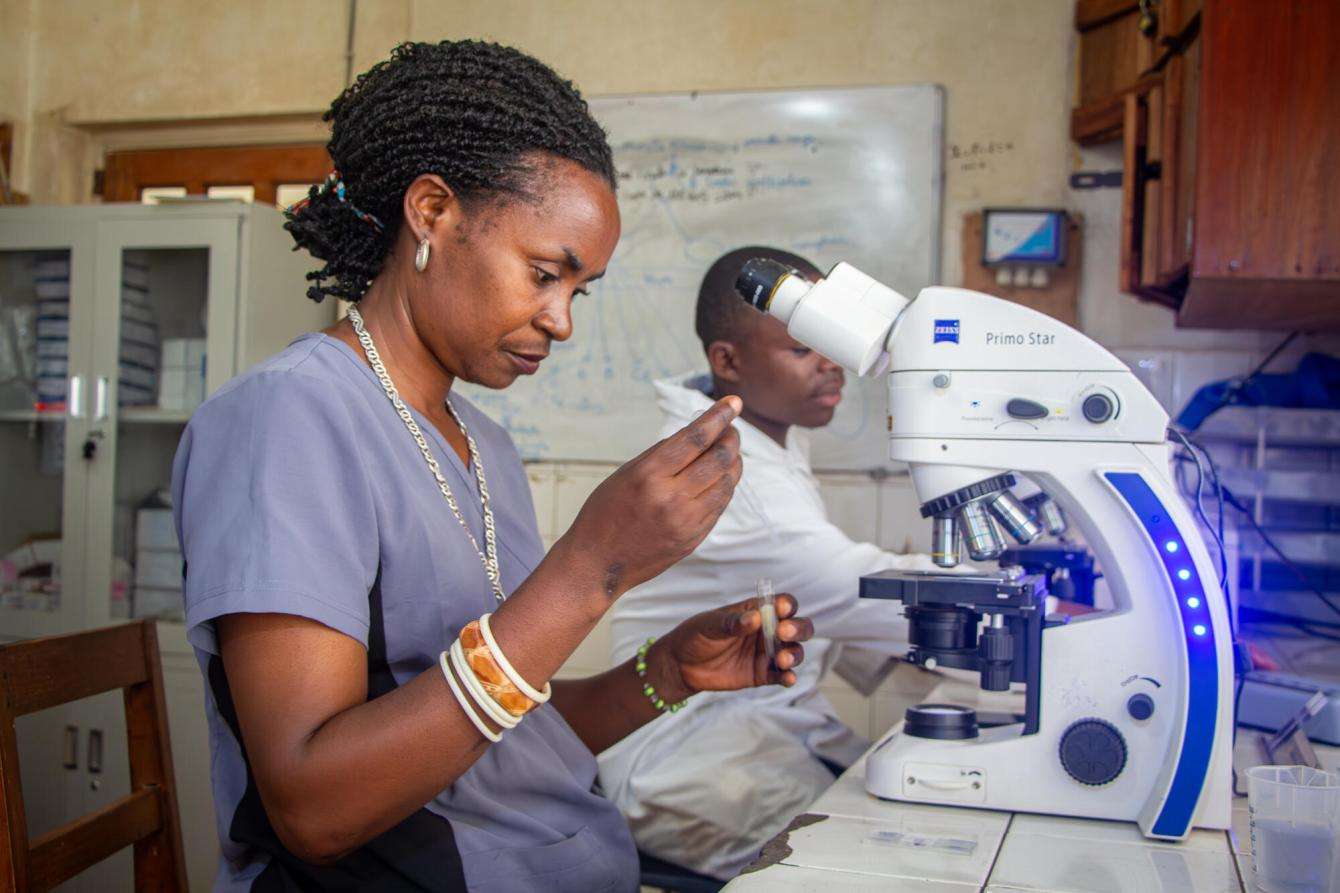 Lab technician analyzes samples from patients. 