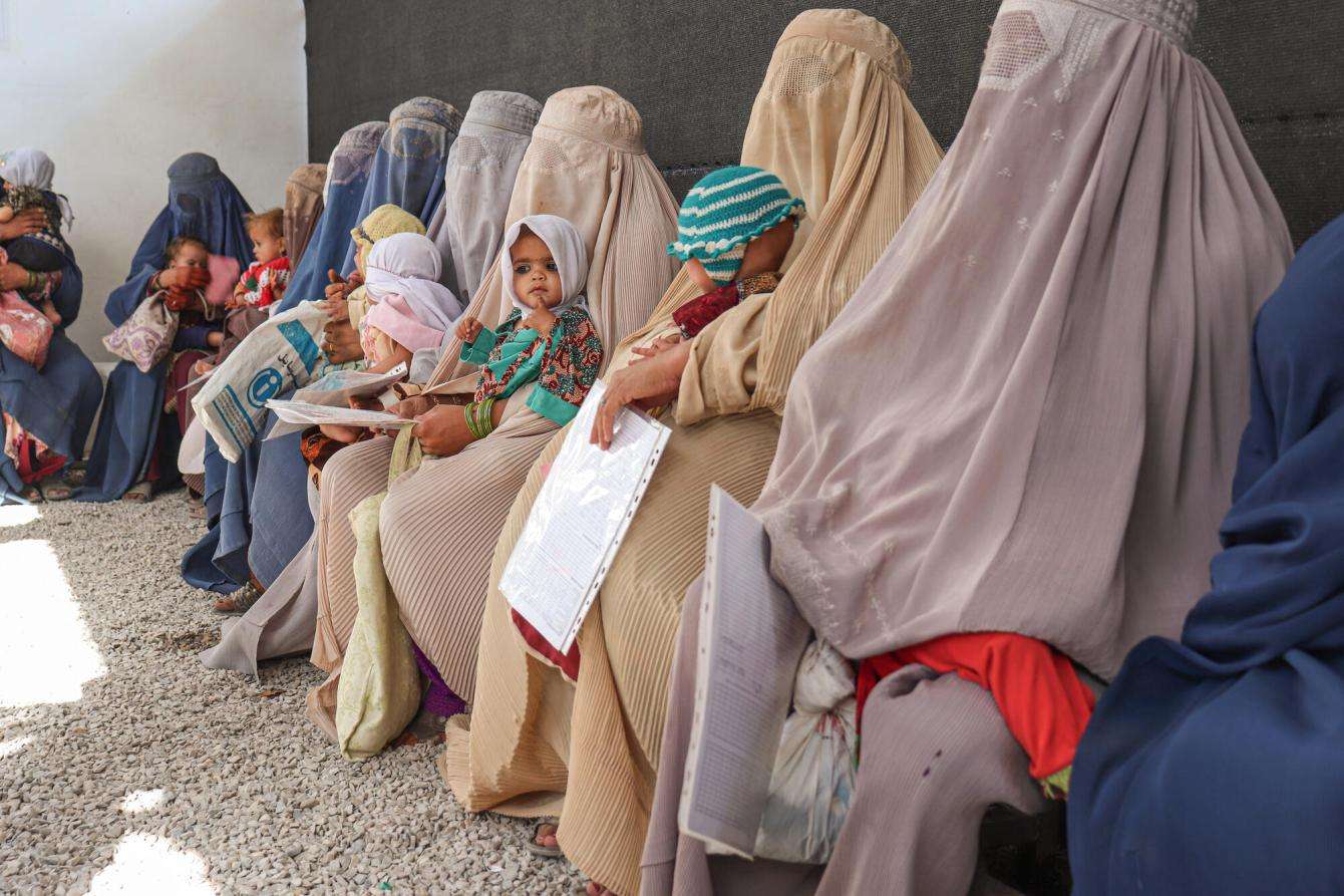 Women wait with their children in an outpatient feeding clinic in Kandahar, Afghanistan. 