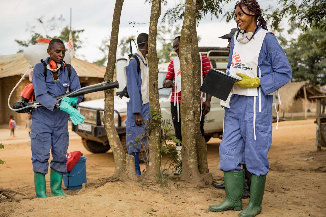 An MSF team sprays insecticide and distributes mosquito nets to people living in swampy areas in DRC.