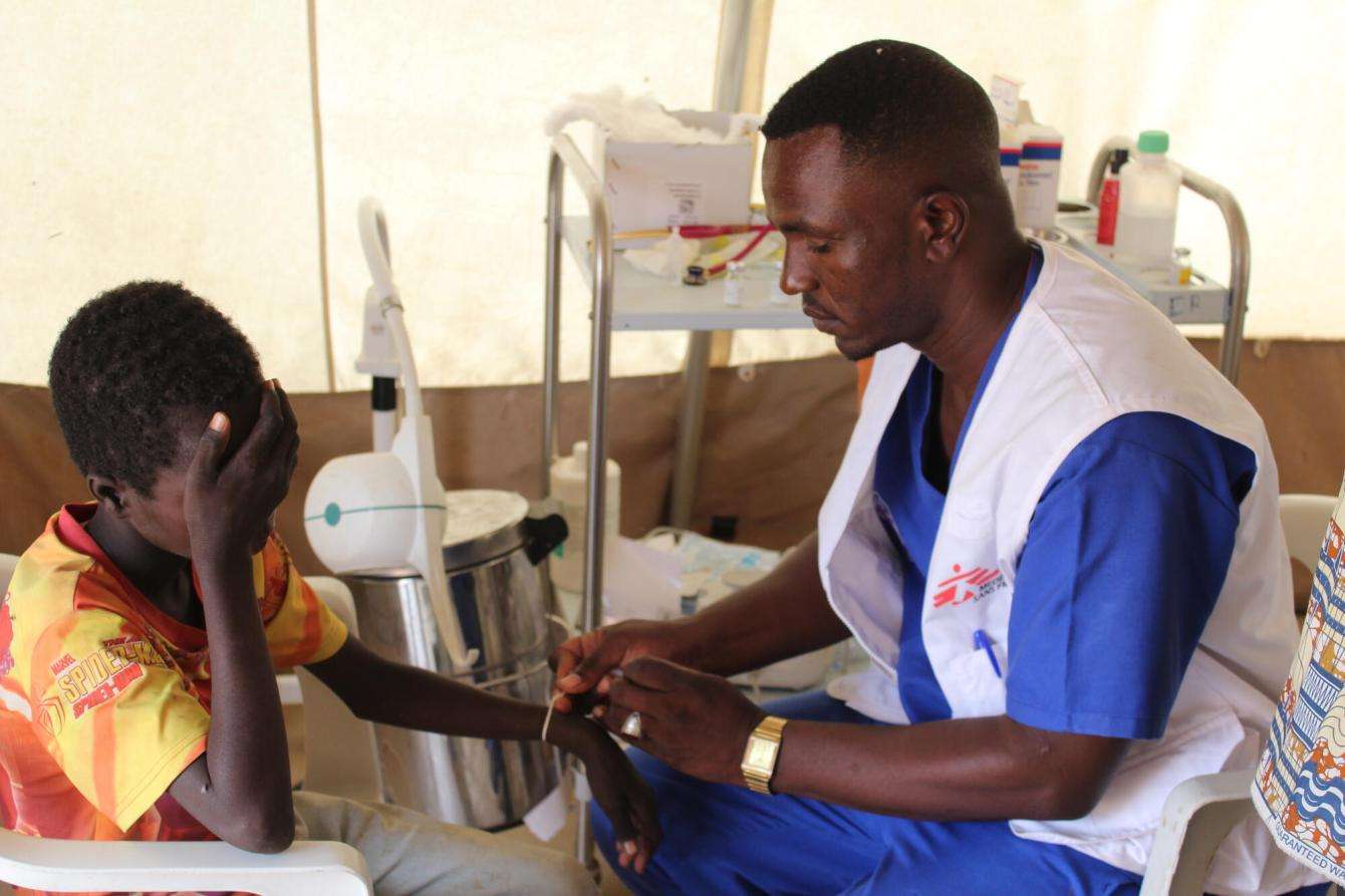 A child is screened for malnutrition in Zamzam camp, Sudan.