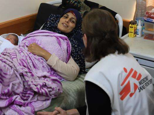 A mother and newborn recover in Al Nasser Hospital in Gaza. 