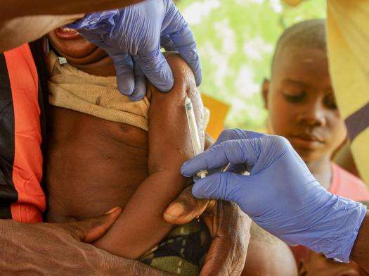 A child vaccinated against measles in DRC. 