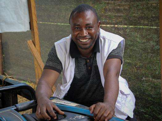 MSF worker smiles in DRC. 