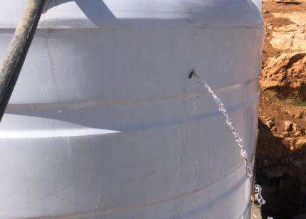 A water tank with bullet holes, caused by settlers shooting at homes, herd, and water tanks, according to the community in South Hebron Hills, West Bank, Occupied Palestinian Territories.