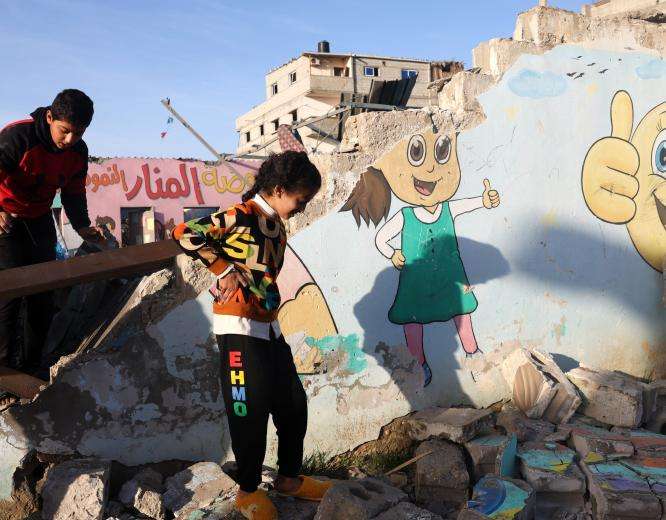 Palestinian children play in the rubble in Gaza.