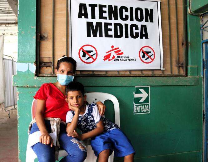 Yamilex, a migrant in Tumbes, Peru, with her son.