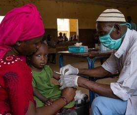 Child getting a measles vaccination in Timbuktu