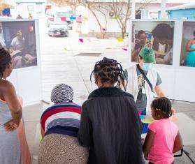 Migrants gather around a table