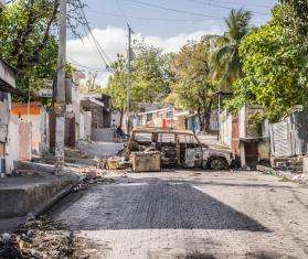 A destroyed car blocking a road in Port-au-Prince, Haiti.