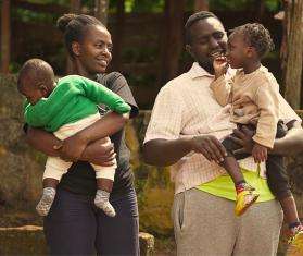 Michael Karongo with his wife Mary Wairimu—his greatest supporter in his recovery journey—and their children in Kenya.