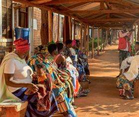 Health promoter, Bayubahe Jerome, educates mothers on the benefits of breastfeeding at Nduta Camp Clinic.