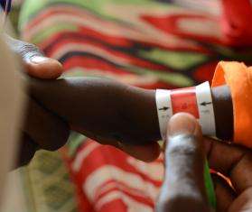 A child is screened for malnutrition in Zamzam camp, Sudan.