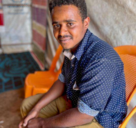 A Sudanese refugee sits in a border center in South Sudan. 