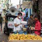 MSF staff Ganpat distributing soap and masks to hawkers on the street