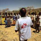 An MSF translator provides information to women and children waiting for a medical consultation at a mobile clinic in the village of Adiftaw, Tigray.