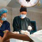 MSF nurse and surgeon operate on a patient at Bashair Teaching Hospital in Khartoum, Sudan, during the conflict.